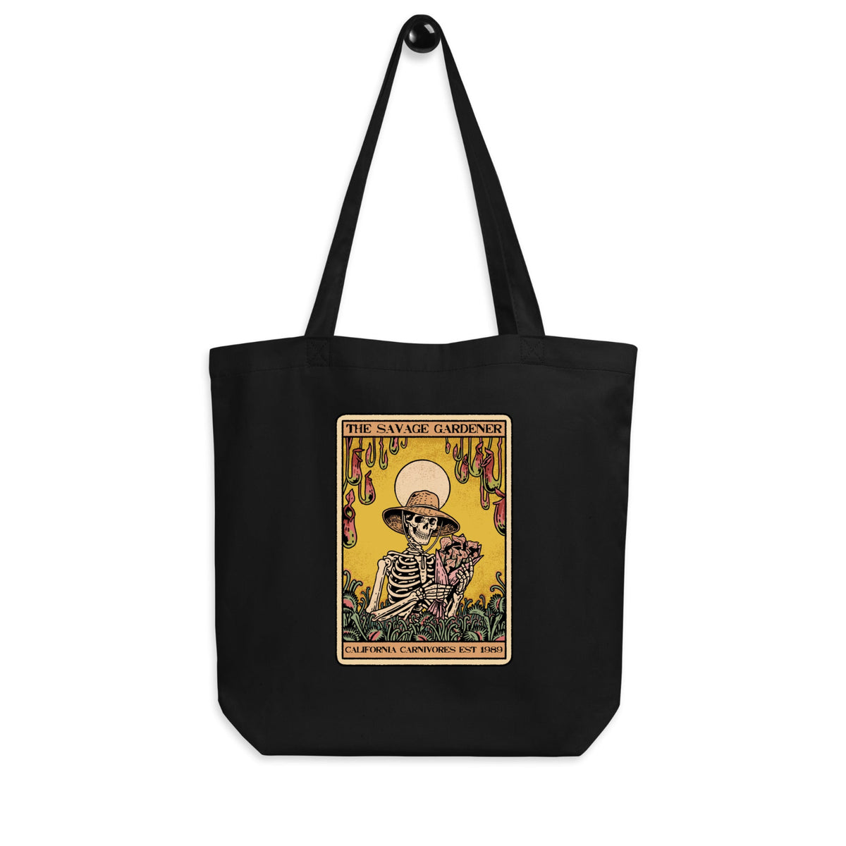 Black tote bag with a colorful graphic of a skeleton and text on a white background