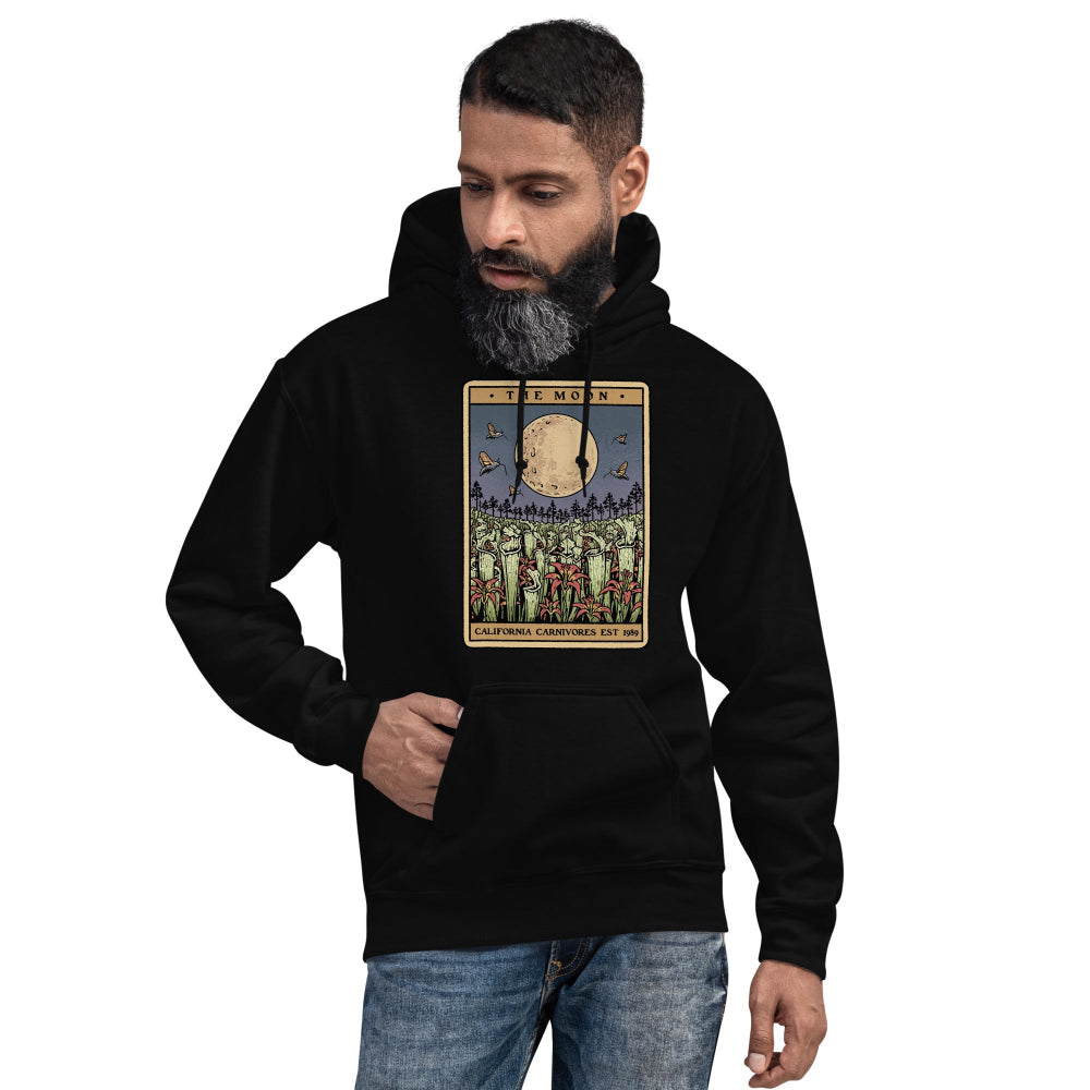 Man wearing a maroon hoodie with text on a white background