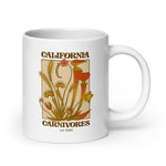 White mug with California Carnivores design featuring plants on a beige background