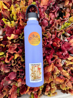 Purple water bottle with California Carnivores logo on a bed of colorful leaves