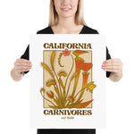Person holding a poster with 'California Carnivores' design featuring plant illustrations.