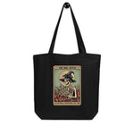 Black tote bag with a graphic design featuring a skeleton in a witch hat and text on a white background