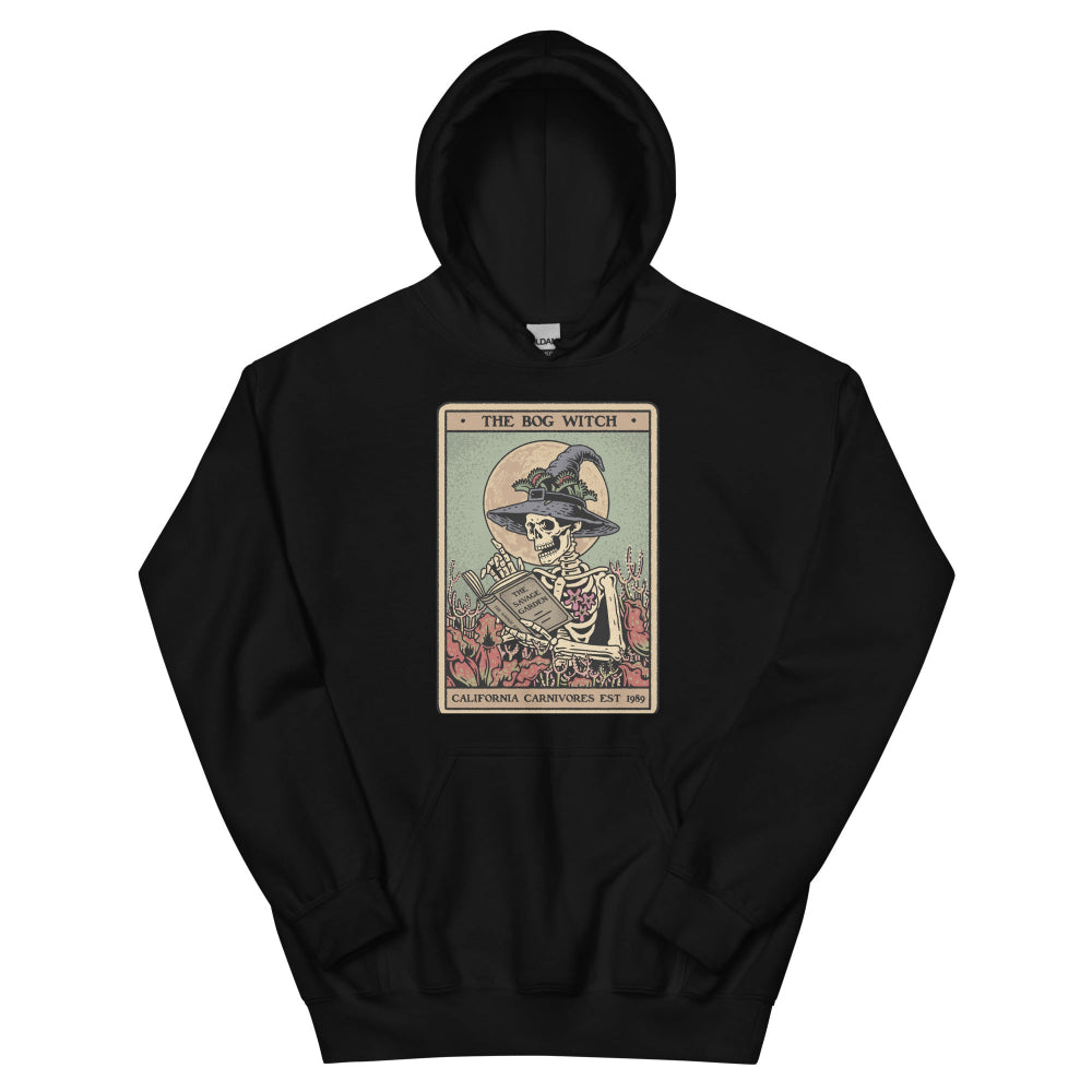 Black hoodie with a graphic design of a skeleton in a witch hat and broomstick on a white background