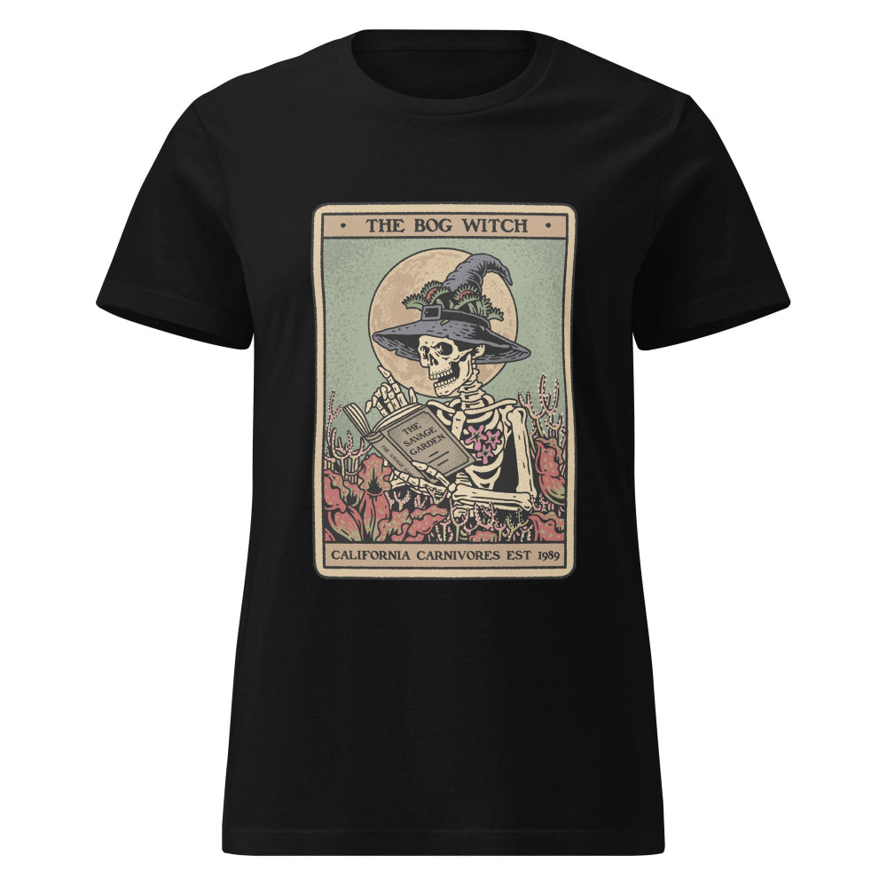 Black t-shirt with a graphic of a skeleton wearing a witch hat and holding a book, labeled 'The Bog Witch' on a white background.