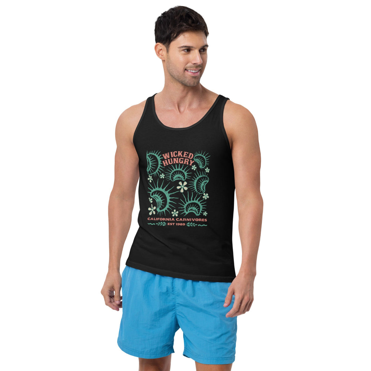 California Carnivores unisex tank top with Wicked Hungry in coral, in the upper middle, surrounded by wood block print style flytraps in teal on male model