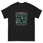 Black California Carnivores unisex shirt with Wicked Hungry in coral, in the upper middle, surrounded by wood block print style flytraps in teal. 