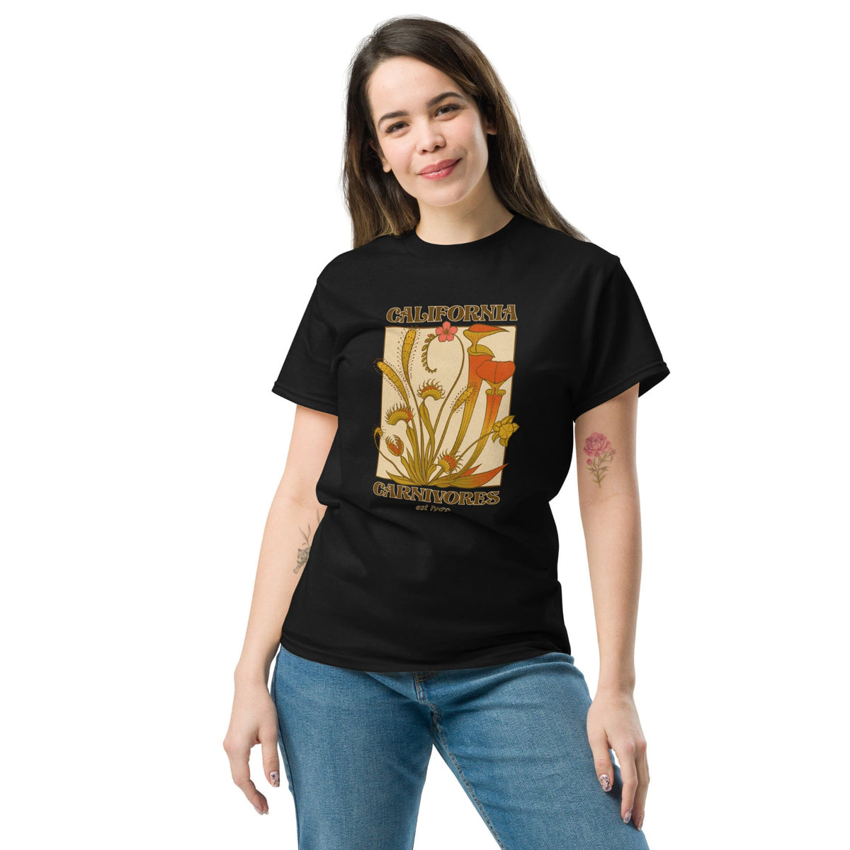 Woman wearing a black t-shirt with a graphic design on a white background