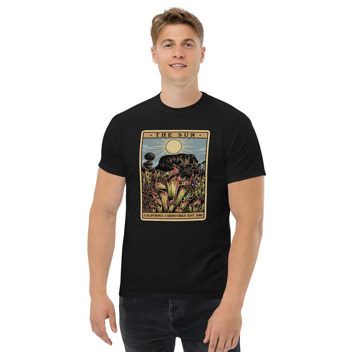 Black t-shirt with a graphic design of Heliamphora as the Sun tarot card on male model