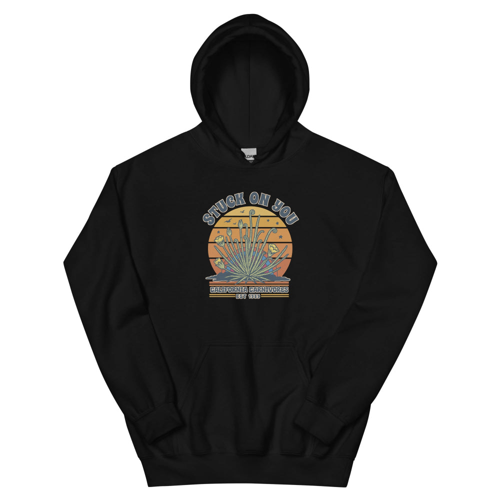 Black hoodie with a graphic of a face and text on a white background