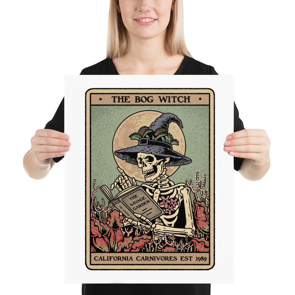 Person holding a framed artwork of 'The Bog Witch' by California Carnivores.
