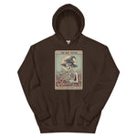Brown hoodie with a graphic of a skeleton in a witch hat and broomstick on a white background