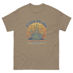Brown t-shirt with a graphic design featuring cacti and text on a white background