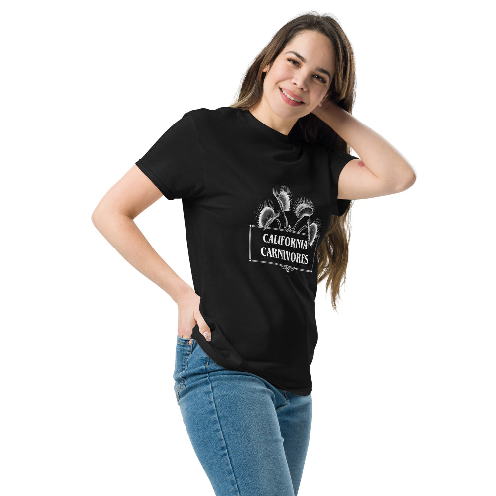 Woman wearing a black t-shirt with a logo, standing against a white background