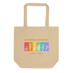 Beige tote bag with colorful graphic and text on a white background