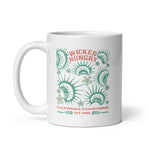 California Carnivores mug with Wicked Hungry in coral, in the upper middle, surrounded by wood block print style flytraps in teal