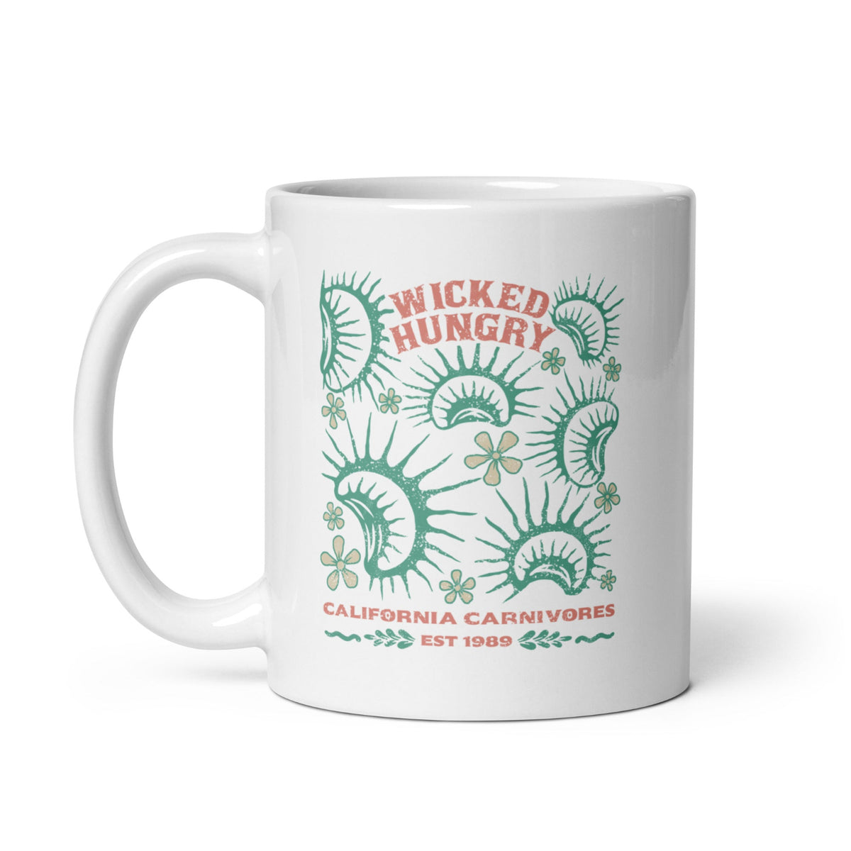 California Carnivores mug with Wicked Hungry in coral, in the upper middle, surrounded by wood block print style flytraps in teal