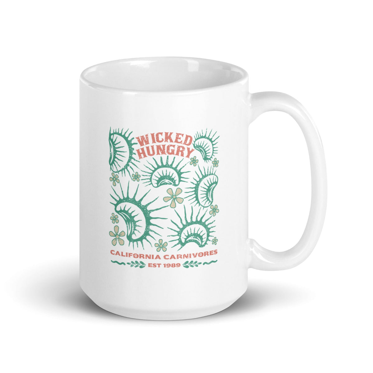 California Carnivores mug with Wicked Hungry in coral, in the upper middle, surrounded by wood block print style flytraps in teal