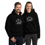 Two people wearing black hoodies with 'california carnivores' logo on a white background