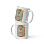 Two white mugs with decorative floral design and text on a white background