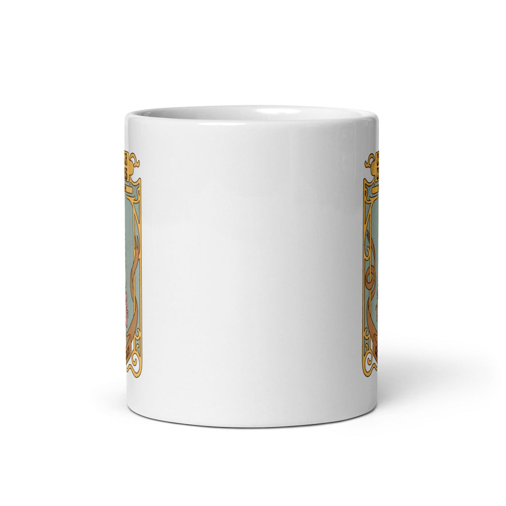 White mug with a gold and black design on a white background