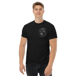 Man wearing a black t-shirt with a logo on a white background