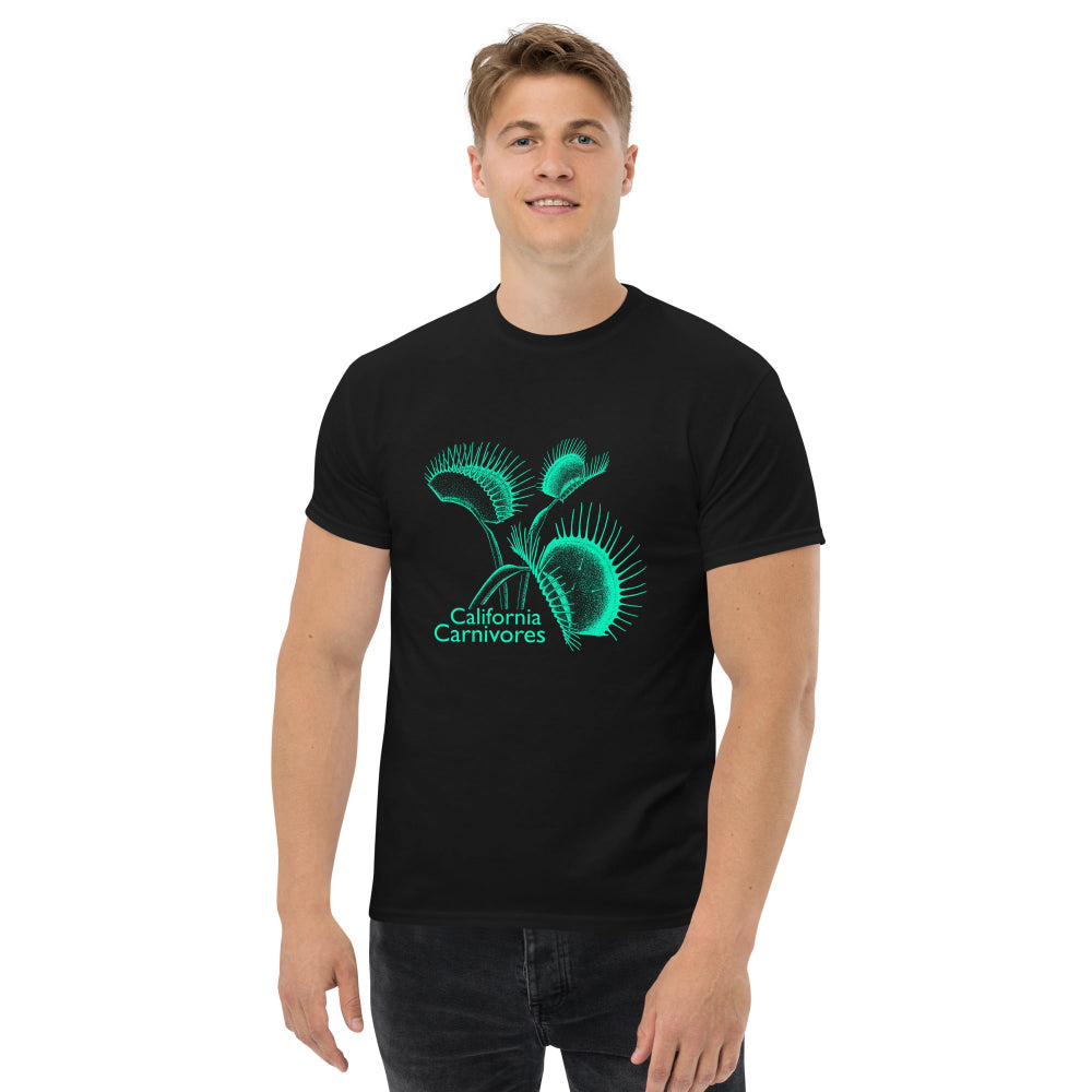 Person wearing a black t-shirt with a teal carnivore plant design on a white background