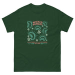 Forest Green California Carnivores unisex shirt with Wicked Hungry in coral, in the upper middle, surrounded by wood block print style flytraps in teal. 