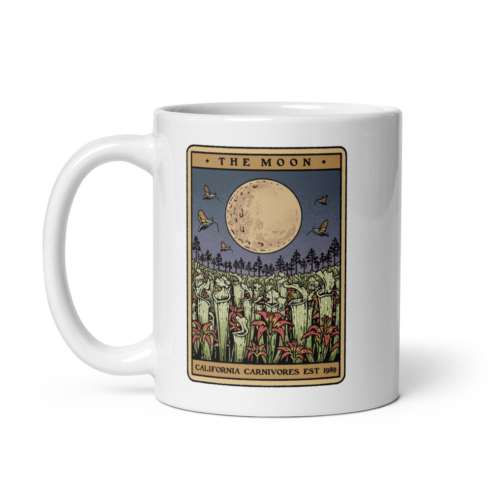 White mug with a tarot card-style design featuring a moon and nature elements on a white background.