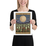 Person holding a print of the tarot card themed design with a moon and plants