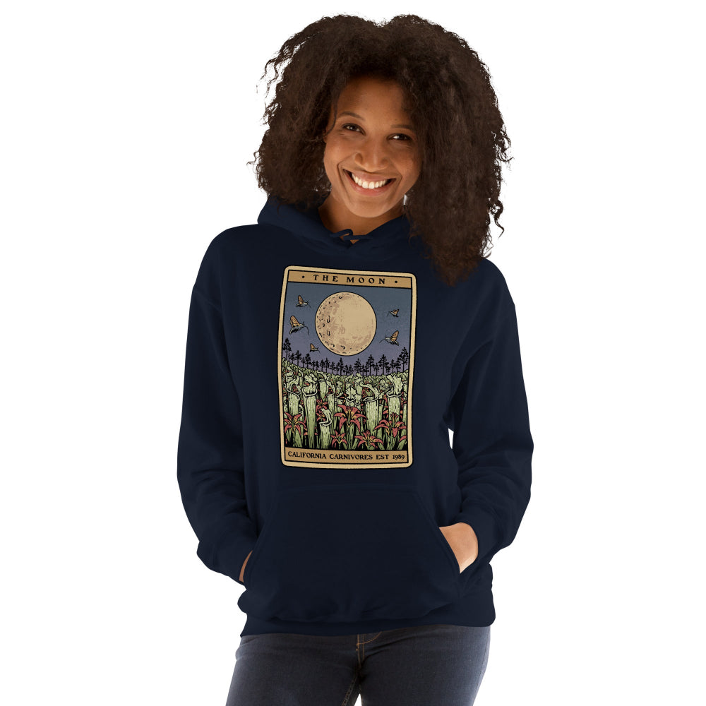 Person wearing a navy blue hoodie with a graphic design on a white background
