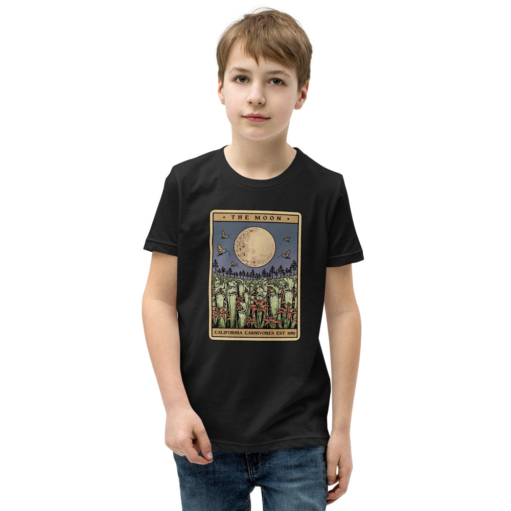 Child wearing a black t-shirt with a graphic design on a white background