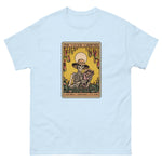 Light blue t-shirt with a graphic of a skeleton gardener and text 'The Savage Gardener' on a white background.