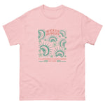 Light Pink California Carnivores unisex shirt with Wicked Hungry in coral, in the upper middle, surrounded by wood block print style flytraps in teal. 