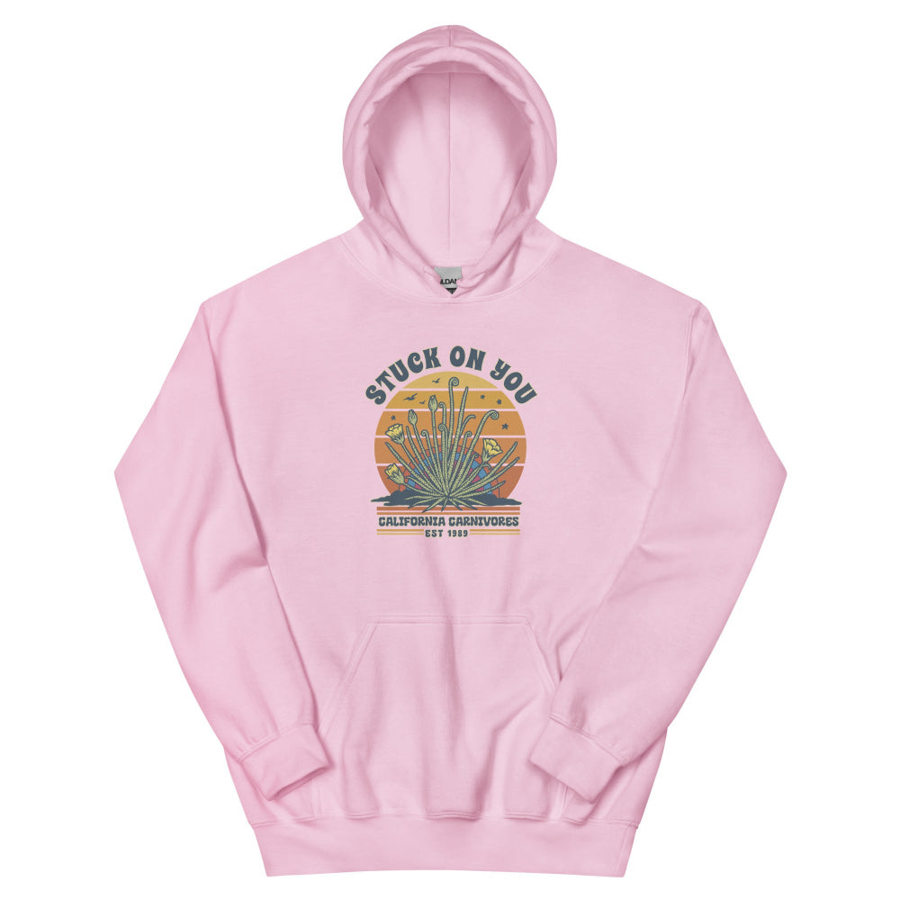 Pink hoodie with a graphic design on a white background