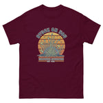 Maroon t-shirt with a graphic design and text on a white background