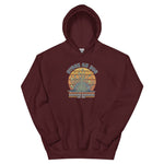 Maroon hoodie with a graphic of a face and text on a white background