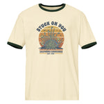 Beige t-shirt with graphic design and text on a white background