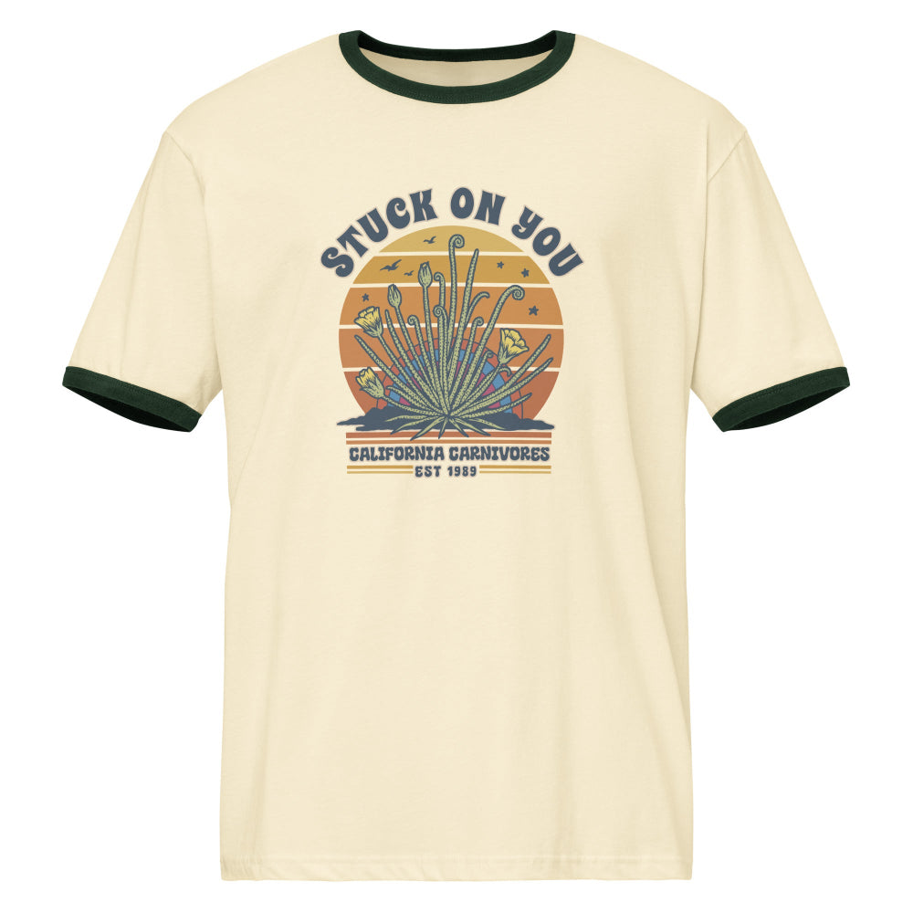 Beige t-shirt with graphic design and text on a white background