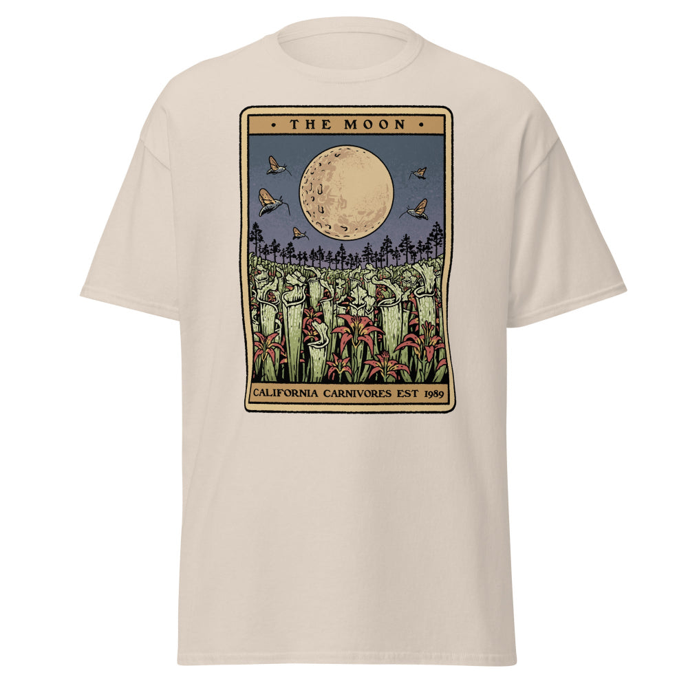 Beige t-shirt with 'The Moon' graphic design featuring a moon and trees on a white background