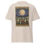 Beige t-shirt with 'The Moon' graphic design featuring a moon and trees on a white background