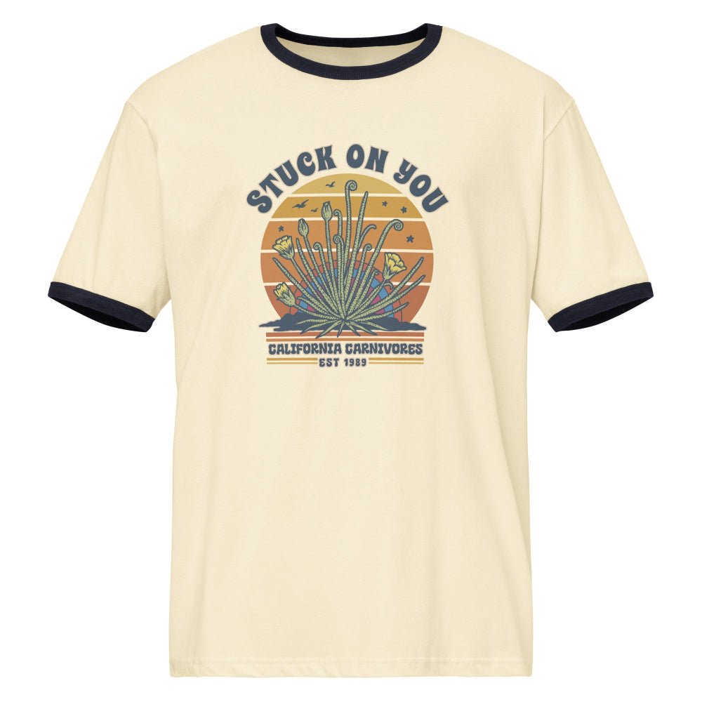 Beige t-shirt with graphic design and text on a white background