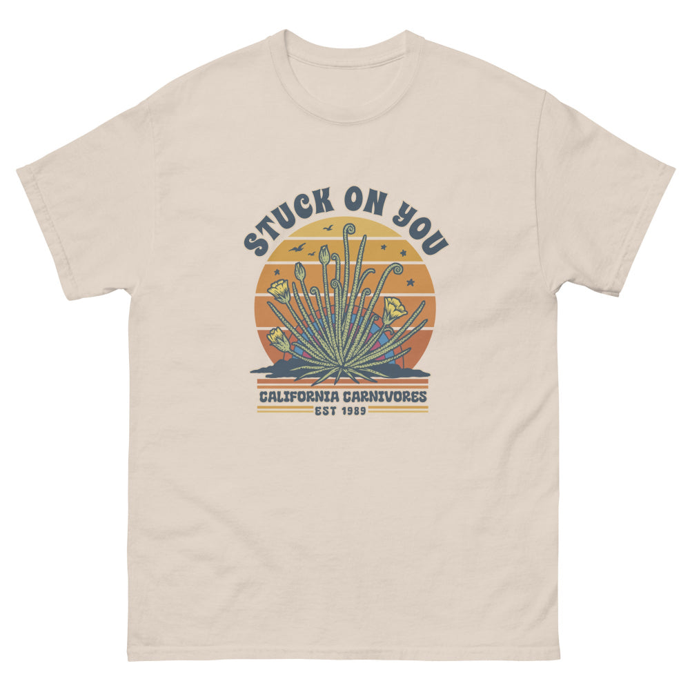 Beige t-shirt with graphic design and text on a white background
