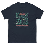 Navy California Carnivores unisex shirt with Wicked Hungry in coral, in the upper middle, surrounded by wood block print style flytraps in teal. 