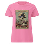 Pink t-shirt with a graphic of a skeleton in a witch hat and text on a white background