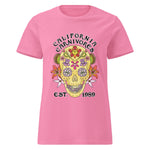 Pink t-shirt with a colorful skull design and text on a white background