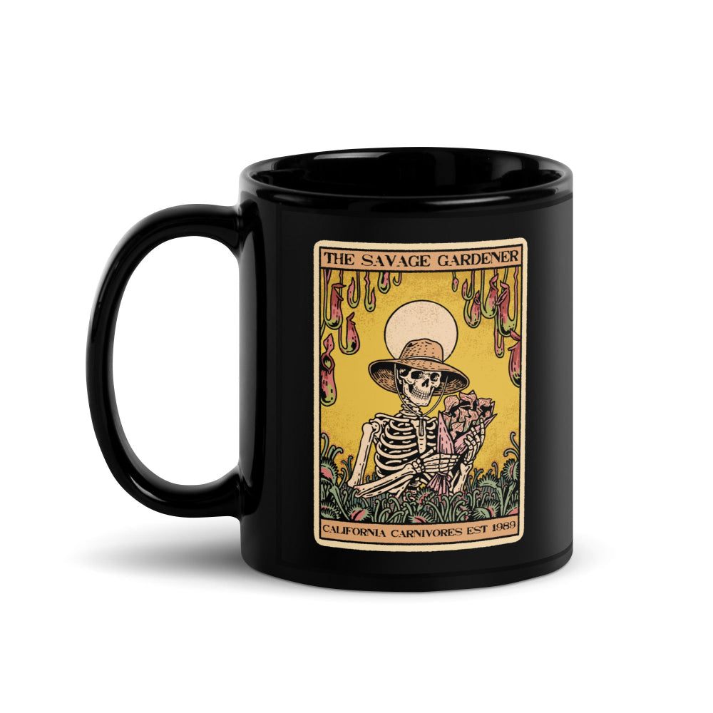 Black mug with a skeleton design and 'The Savage Gardener' text on a white background