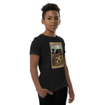 The Shining Sun youth unisex shirt has a heliamphora in the sun styled after a tarot card worn by a model