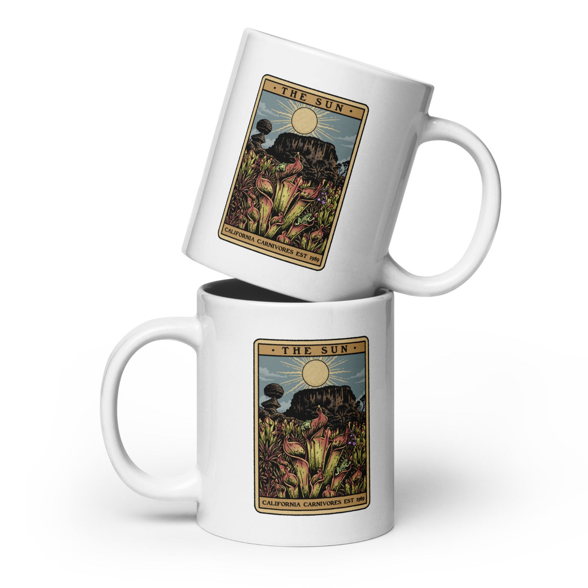 Two white mugs with 'The Sun' tarot card design stacked on a white background