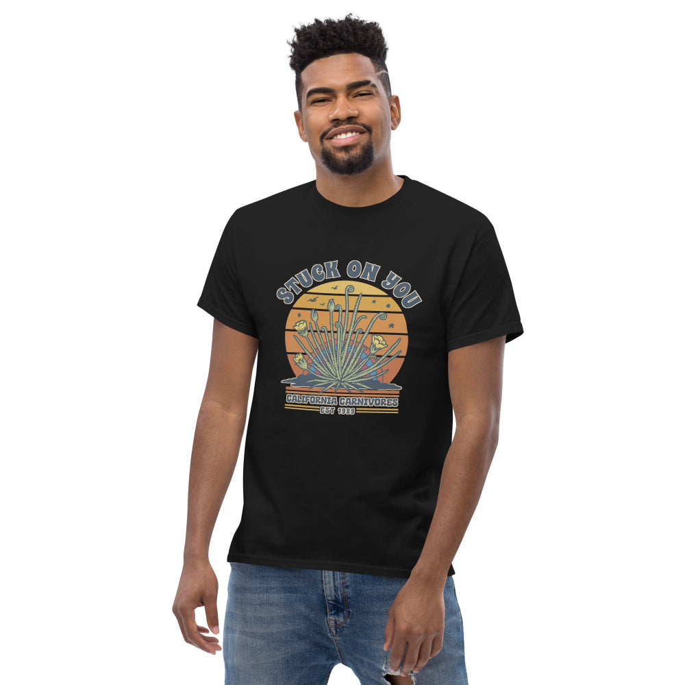 Man wearing a black shirt with Stuck On you graphic design