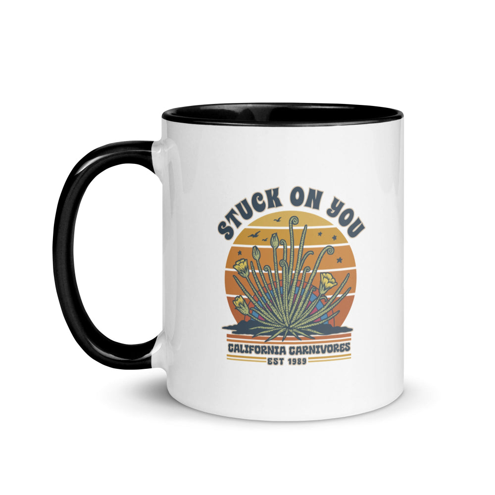 White mug with black handle featuring a graphic design and text on a white background